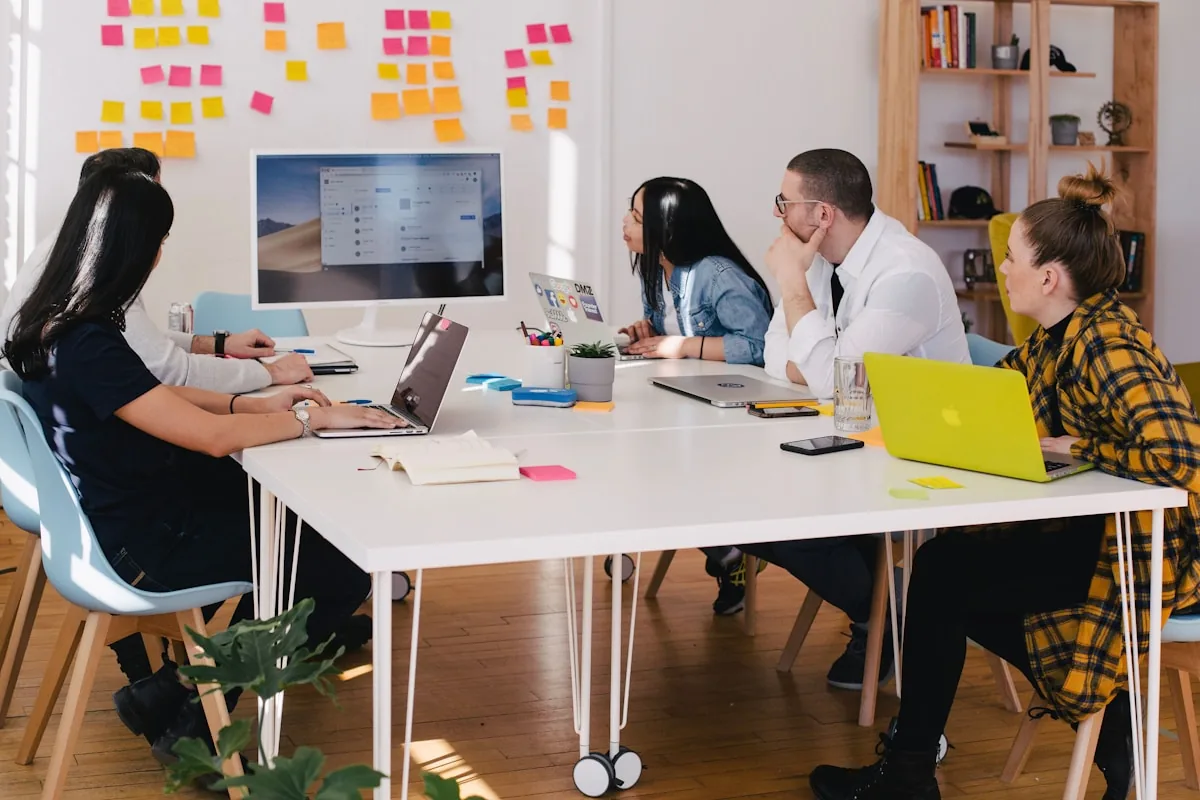 A small TechJan team working together at one table