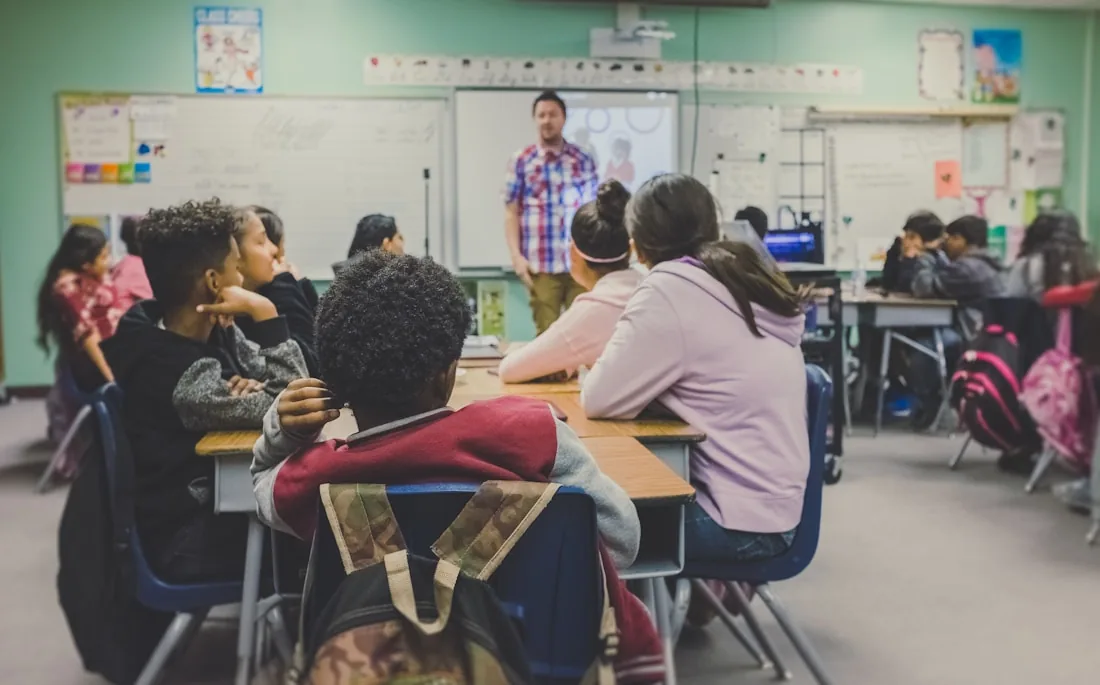 A teacher addressing a classroom