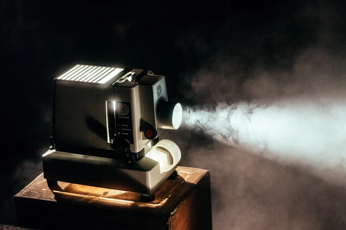 A film projector casting a beam of light