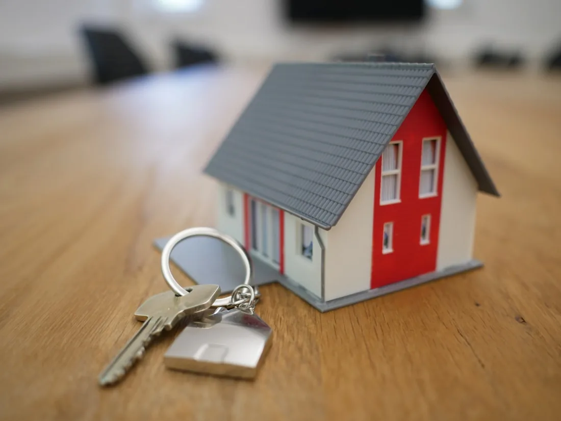 A model house beside a set of keys