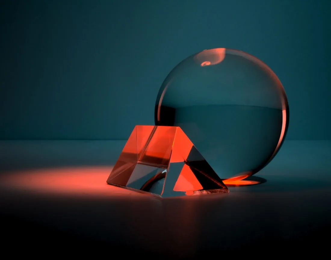 A glass sphere and cube rendered in three dimensions