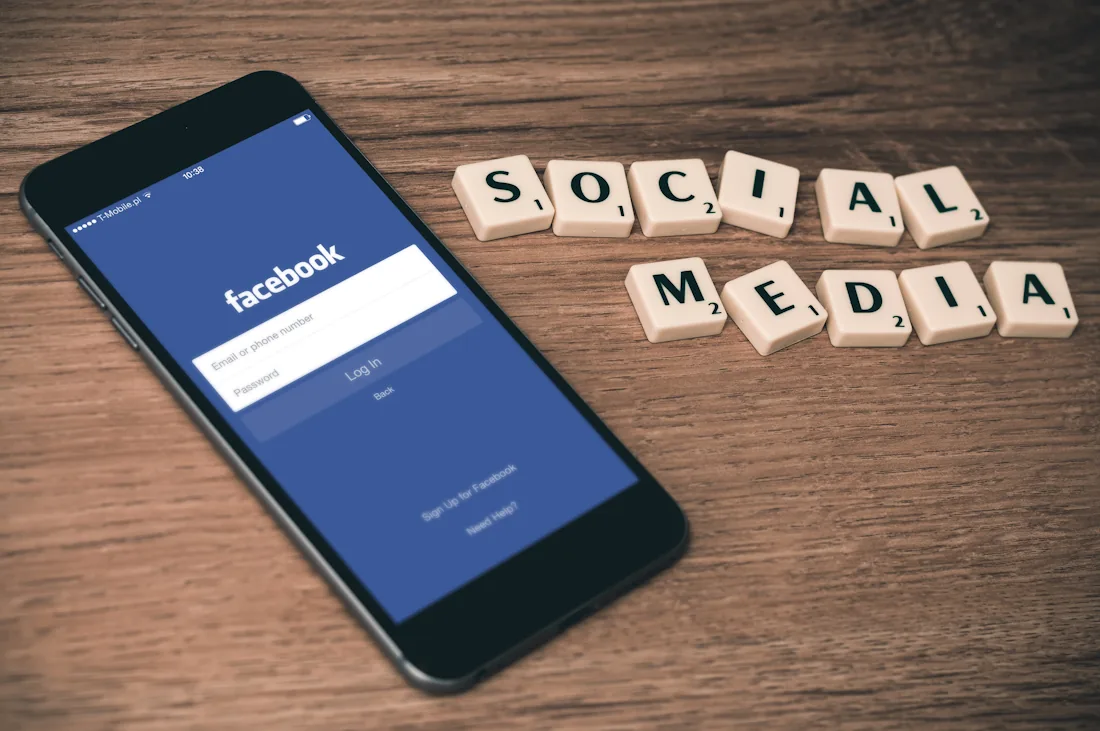 A phone beside the words social media