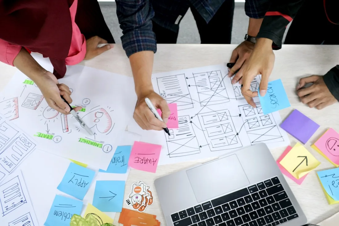 A team sketching wireframes together